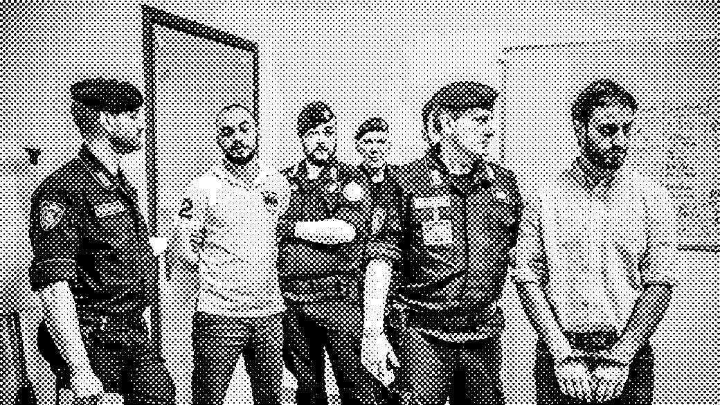 Black and white photograph of Italian carabinieri with two men in handcuffs.